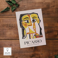 Picasso Stylized Portrait Jacqueline 1962 Abstract Art Print Yellow Red Poster on wooden table.