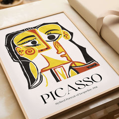 Picasso Stylized Portrait Jacqueline 1962 Abstract Art Print Yellow Red Poster featured in a modern frame on a table.