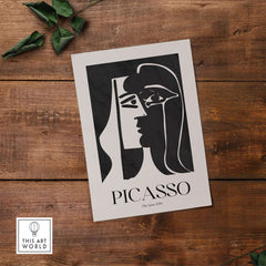 Picasso The Kiss 1979 Black White Abstract Profile Poster Art Print Wall Decor showcased on wooden background.