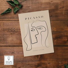 Picasso Two Faces Abstract Profiles Line Art Modern Gallery Poster Wall Art Print on wood background with green leaves.