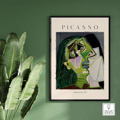 Picasso Weeping Woman 1937 Art Print Famous Cubist Portrait Poster Emotional Wall Art displayed in a modern setting with greenery.