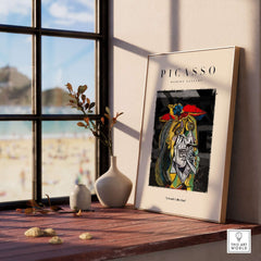 Picasso Weeping Woman Inspired Art Print Abstract Portrait Poster Artwork Collection displayed on a table near a window.