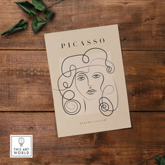 Picasso Woman Curly Hair Line Art Abstract Portrait Poster Modern Gallery Wall Art on a wooden background.