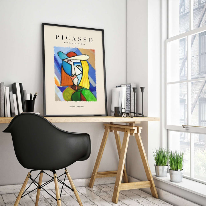 Colorful Picasso-style woman portrait print in modern office setting with a stylish chair and desk.