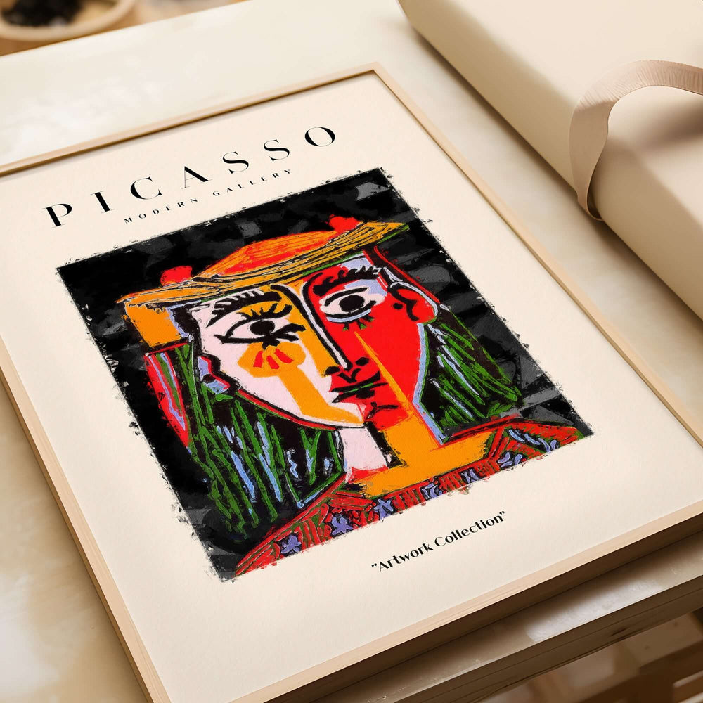 Picasso Woman in Hat Red Yellow Face Portrait Poster Colorful Abstract Artwork Print displayed on a wall.