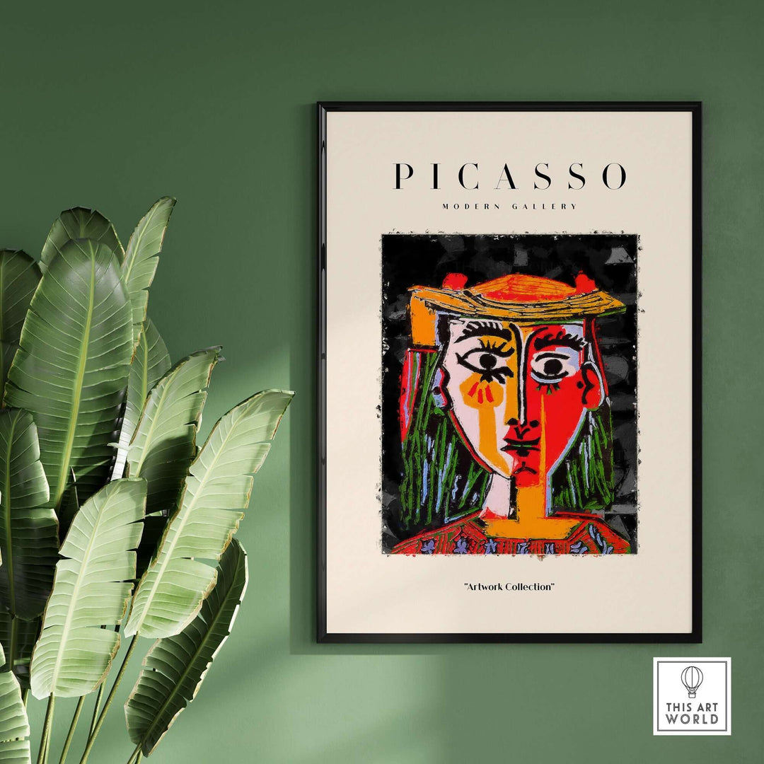 Colorful abstract portrait poster of woman in hat by Picasso, featuring red and yellow face, displayed in modern gallery setting.