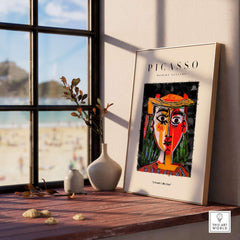 Picasso Woman in Hat Red Yellow Face Portrait Poster Colorful Abstract Artwork Print displayed in a modern interior setting.