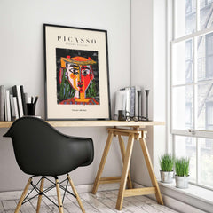 Picasso Woman in Hat Red Yellow Face Portrait Poster Colorful Abstract Artwork Print displayed in a modern workspace.