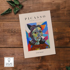 Picasso Woman Portrait Fragmented Abstract Poster Colorful Artwork Print Modern Gallery displayed on wooden surface.
