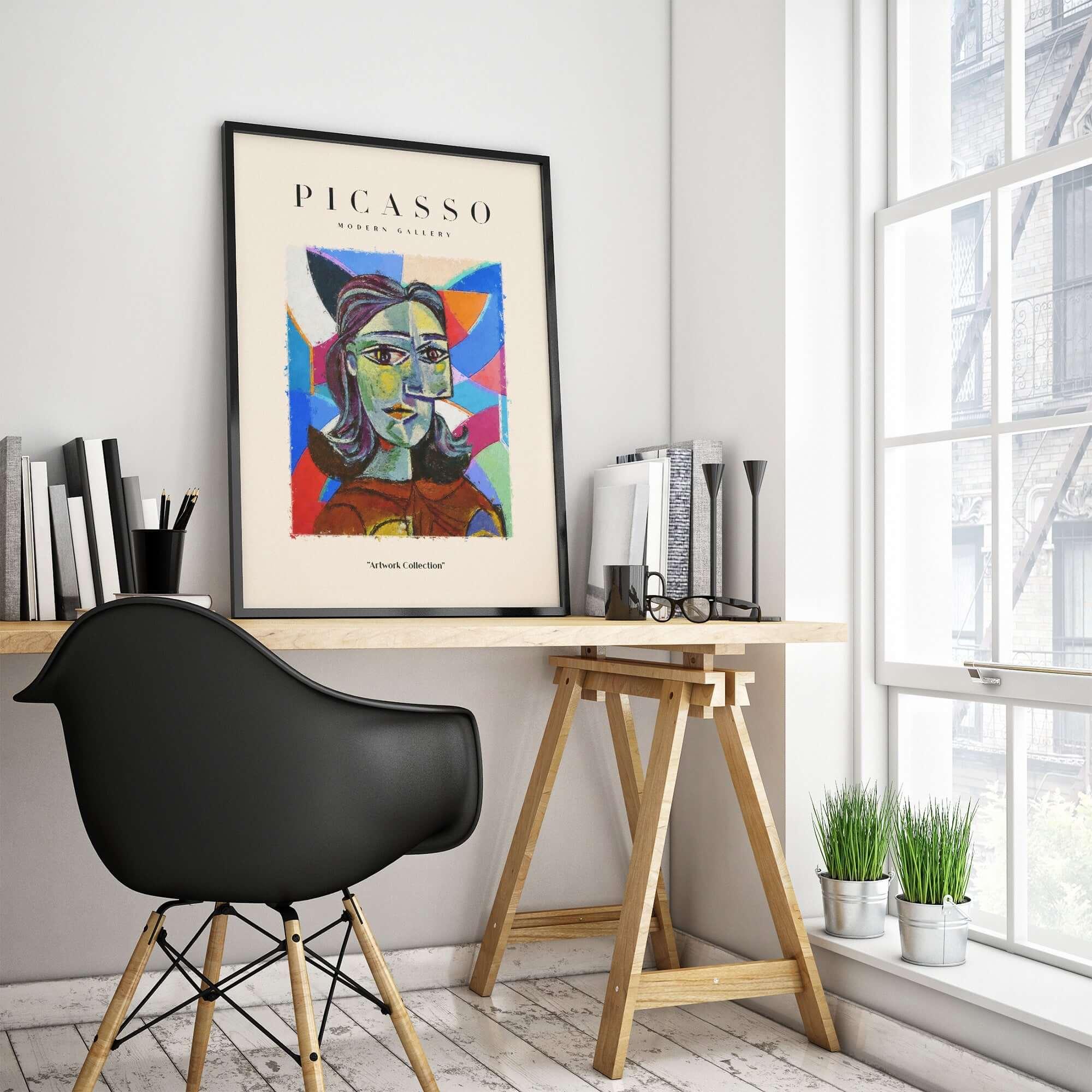 Picasso Woman Portrait Fragmented Abstract Poster Colorful Artwork Print Modern Gallery on wall above a wooden desk.