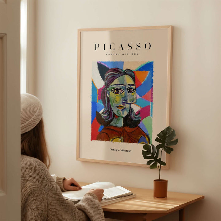 Colorful Picasso-inspired abstract woman portrait poster displayed in modern gallery setting.