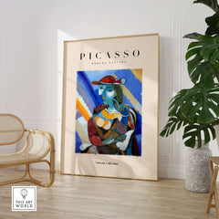 Picasso Woman Red Hat Blue Face Portrait Print Colorful Cubist Poster Artwork Collection on display in modern gallery.