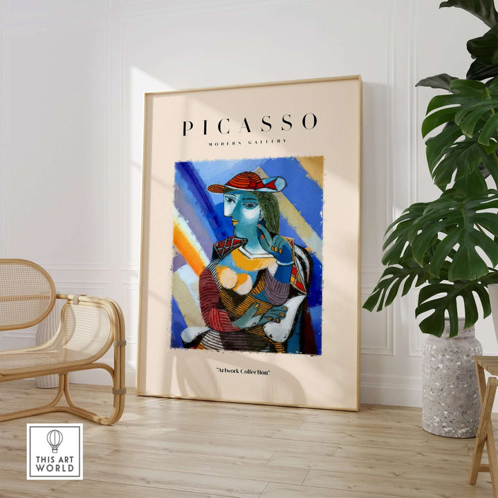 Colorful Picasso-inspired print of a woman with blue face and red hat in Cubist style, showcased in modern interior.
