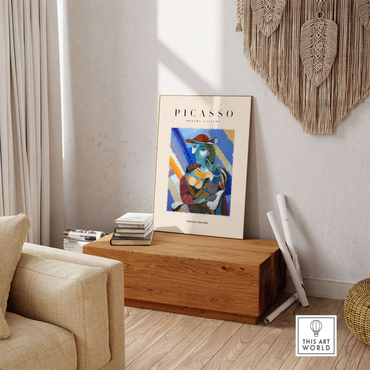 Colorful Cubist poster of a woman with blue face and red hat, displayed in a modern interior setting.