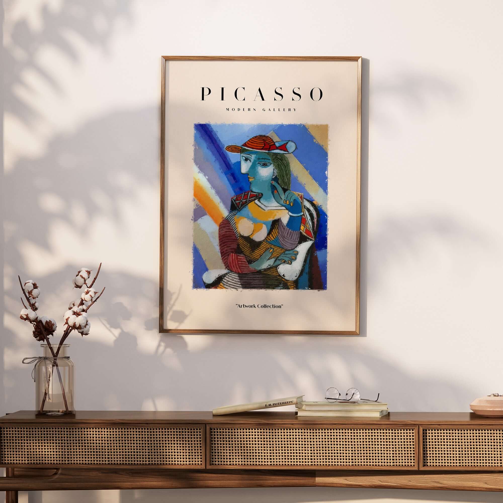 Picasso Woman Red Hat Blue Face Portrait Print Colorful Cubist Poster Artwork Collection displayed on a wall.