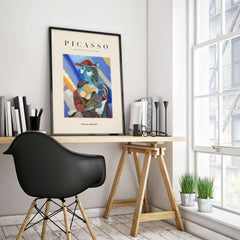 Picasso Woman Red Hat Blue Face Portrait Print Colorful Cubist Poster Artwork Collection displayed in modern workspace.