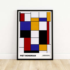 Piet Mondrian Composition A Geometric Abstract Art Print De Stijl Poster Wall Decor on a wooden floor.