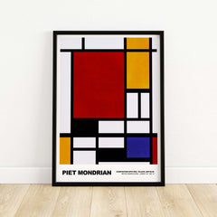 Piet Mondrian Composition Red Yellow Blue 1939 De Stijl Poster Geometric Abstract Print framed on a wall.