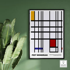 Piet Mondrian Composition Yellow Blue Red 1937 Abstract Grid Art Print Poster Lines framed on a green wall with plants.