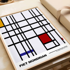 Piet Mondrian Composition Yellow Blue Red 1937 Abstract Grid Art Print Poster Lines displayed in a wooden frame.