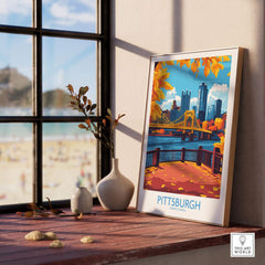 Pittsburgh Poster Pennsylvania displayed on a wooden table, showcasing autumn leaves and iconic Pittsburgh skyline.