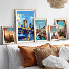 Pittsburgh Travel Print showcased among various travel poster prints, adding vibrant decor to a modern home setting.