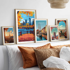 Pittsburgh Wall Art Print displayed among other city travel posters in a stylish home setting.