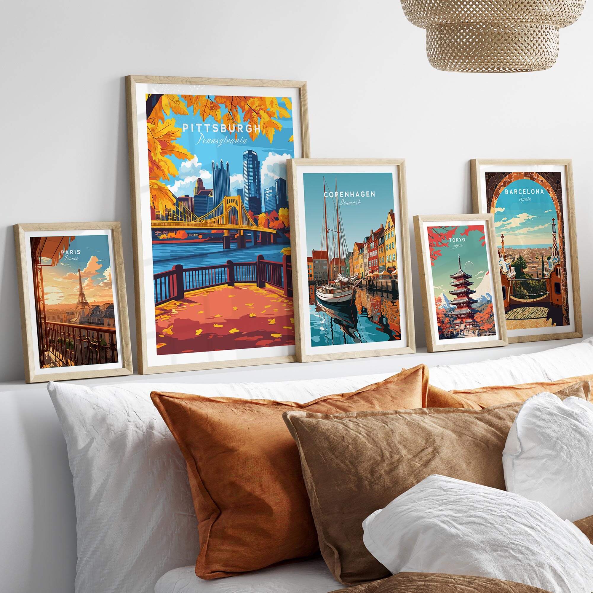 Pittsburgh Wall Art Print displayed among other city travel posters in a stylish home setting.
