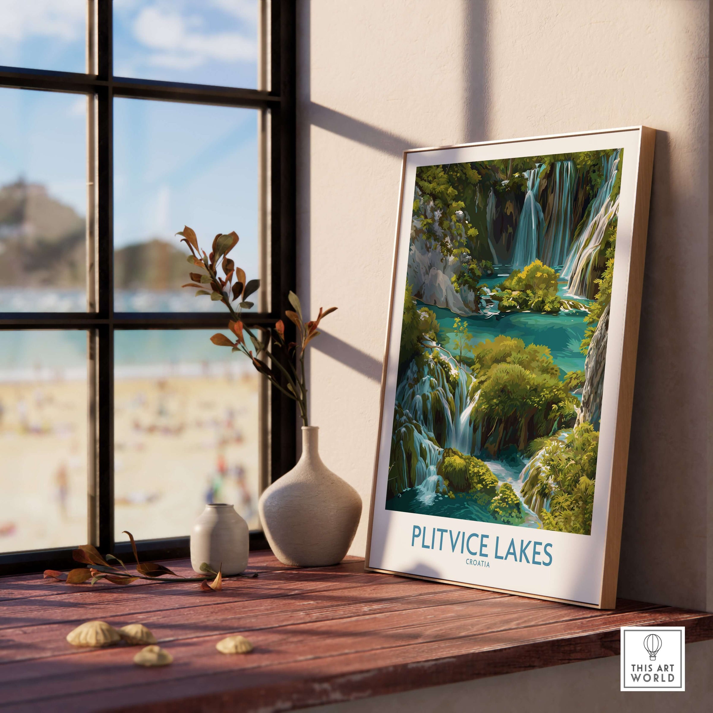 Plitvice Lakes Cascade Poster, Croatia Wall Art, Waterfall Print displayed by a window on a wooden table.