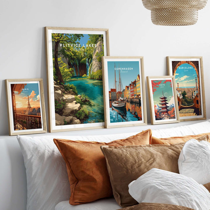 Framed artwork of Plitvice Lakes and cityscapes, vibrant wall decor in a cozy living room setting.