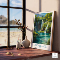 Plitvice Lakes Waterfall Poster, Croatia Travel Print, Blue Lake Wall Decor displayed on a wooden shelf by a sunny window.