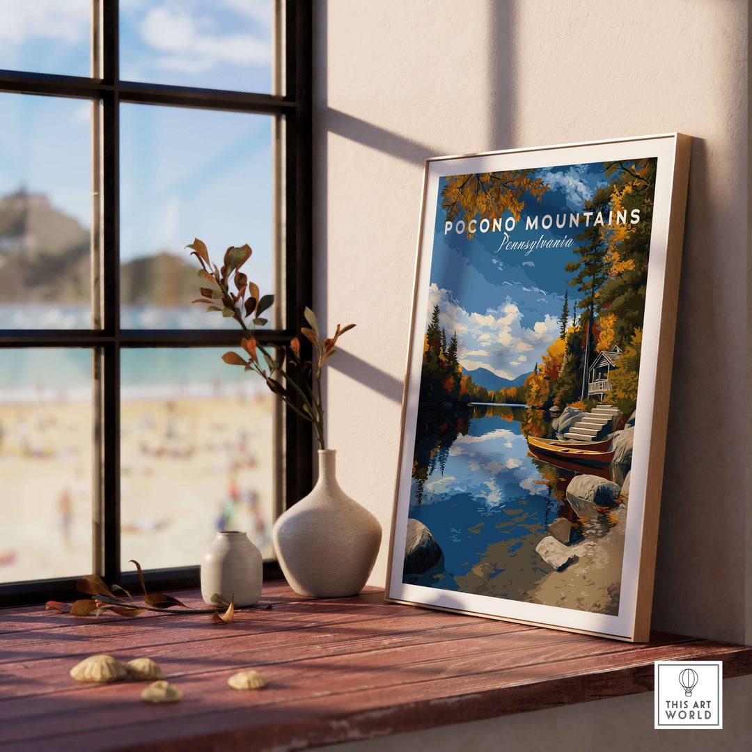 Pocono Mountains Pennsylvania lakeside art print on a windowsill, showcasing serene nature and tranquil scenery.