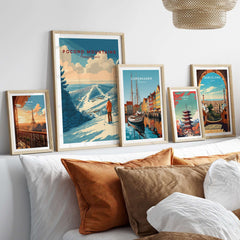 Pocono Mountains Ski Print showcasing scenic landscapes and travel posters framed on a stylish bed setting.