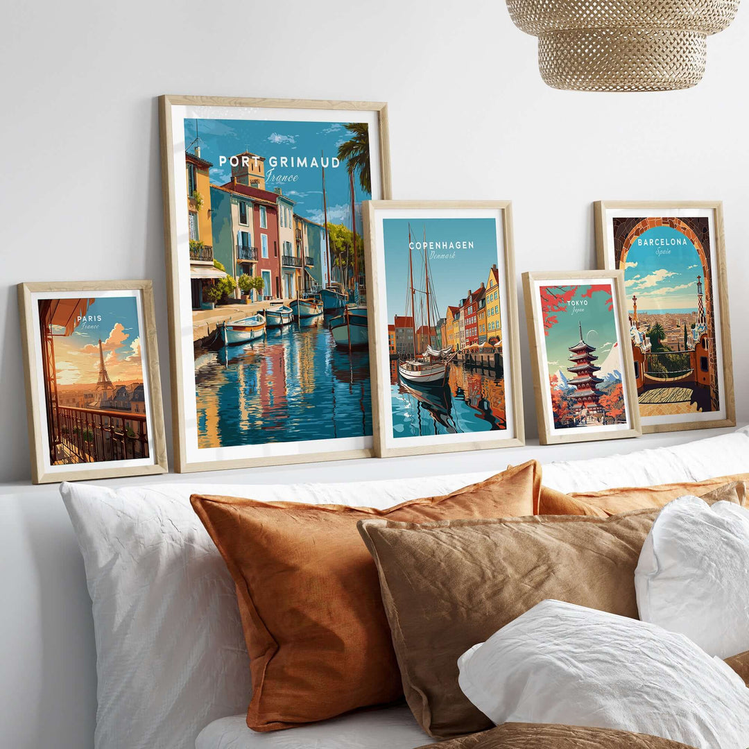 Port Grimaud village art print framed on wall with other travel posters, showcasing stunning water reflections and coastal beauty.