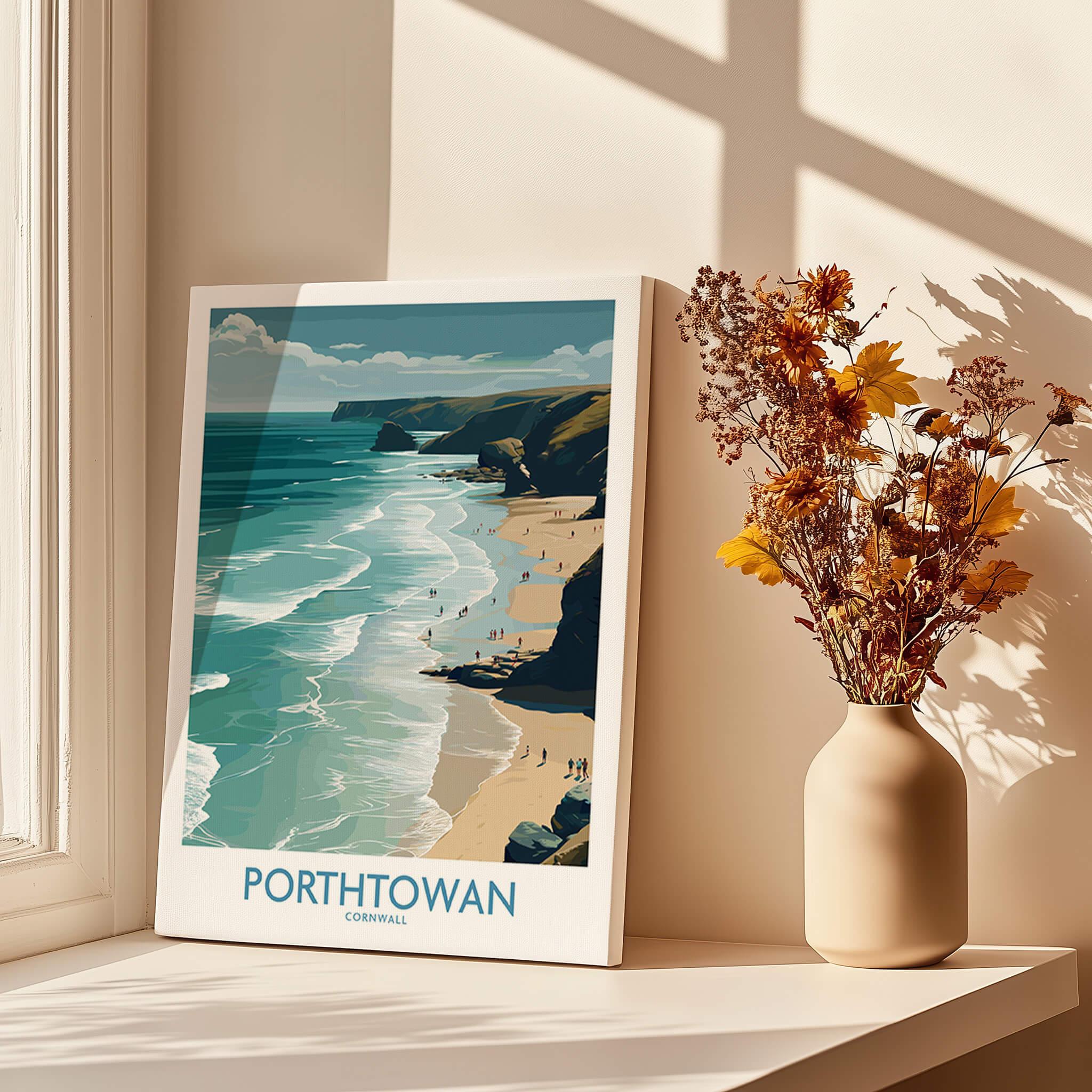 Porthtowan Cornwall Poster | British Seaside Cliff Landscape Canvas Print displayed by a window with flowers.