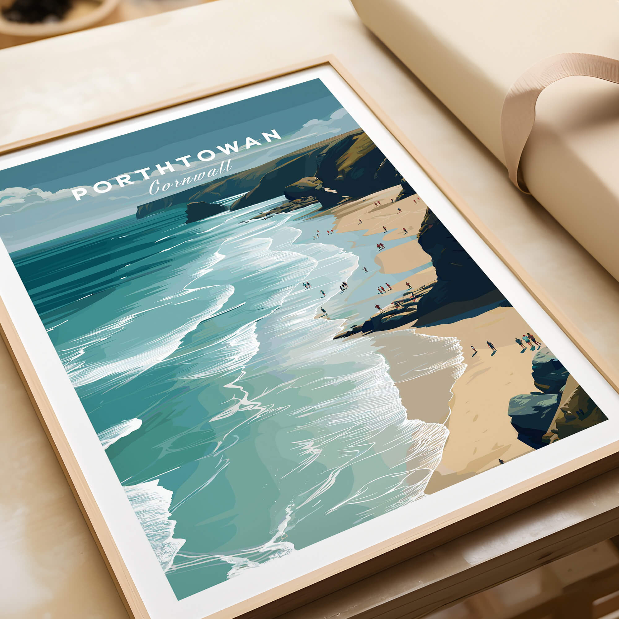 Porthtowan Cornwall Wall Art Print | Atlantic Coastline Beach Travel Poster framed on a table showcasing the stunning ocean view.