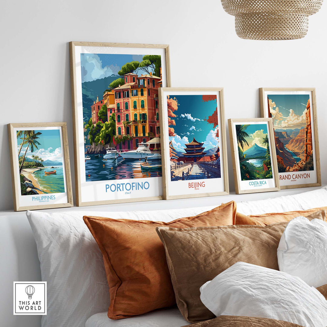 Portofino Print and other travel-themed artworks displayed on a white shelf behind pillows.