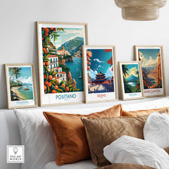 Positano Wall Art displayed among travel prints of Philippines, Beijing, Costa Rica, and Grand Canyon on a stylish sofa.