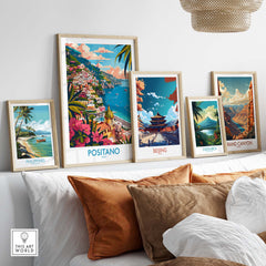 Positano Wall Art Coastal Print for Home or Office Decor displayed among other travel prints on a stylish sofa.
