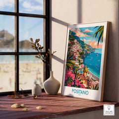 Positano Wall Art Coastal Print for Home or Office Decor displayed by a window with a beach view.
