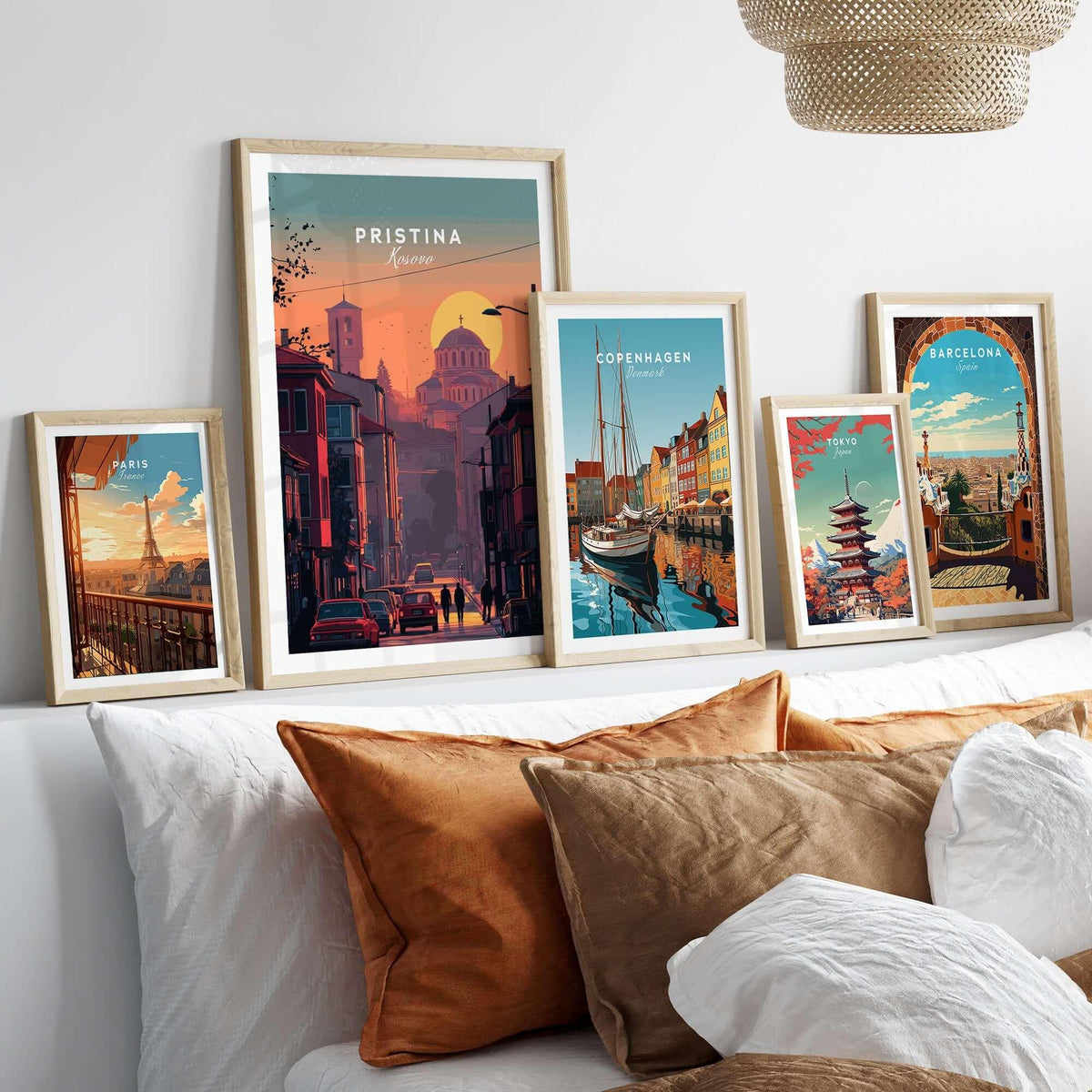 Pristina City Canvas Art Print | Kosovo Travel Wall Decor displayed among framed city artworks on a cozy sofa.