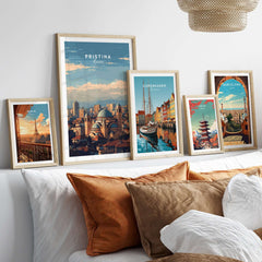 Pristina City View Canvas Print | Kosovo Urban Wall Decor displayed among other city prints on a modern bed.