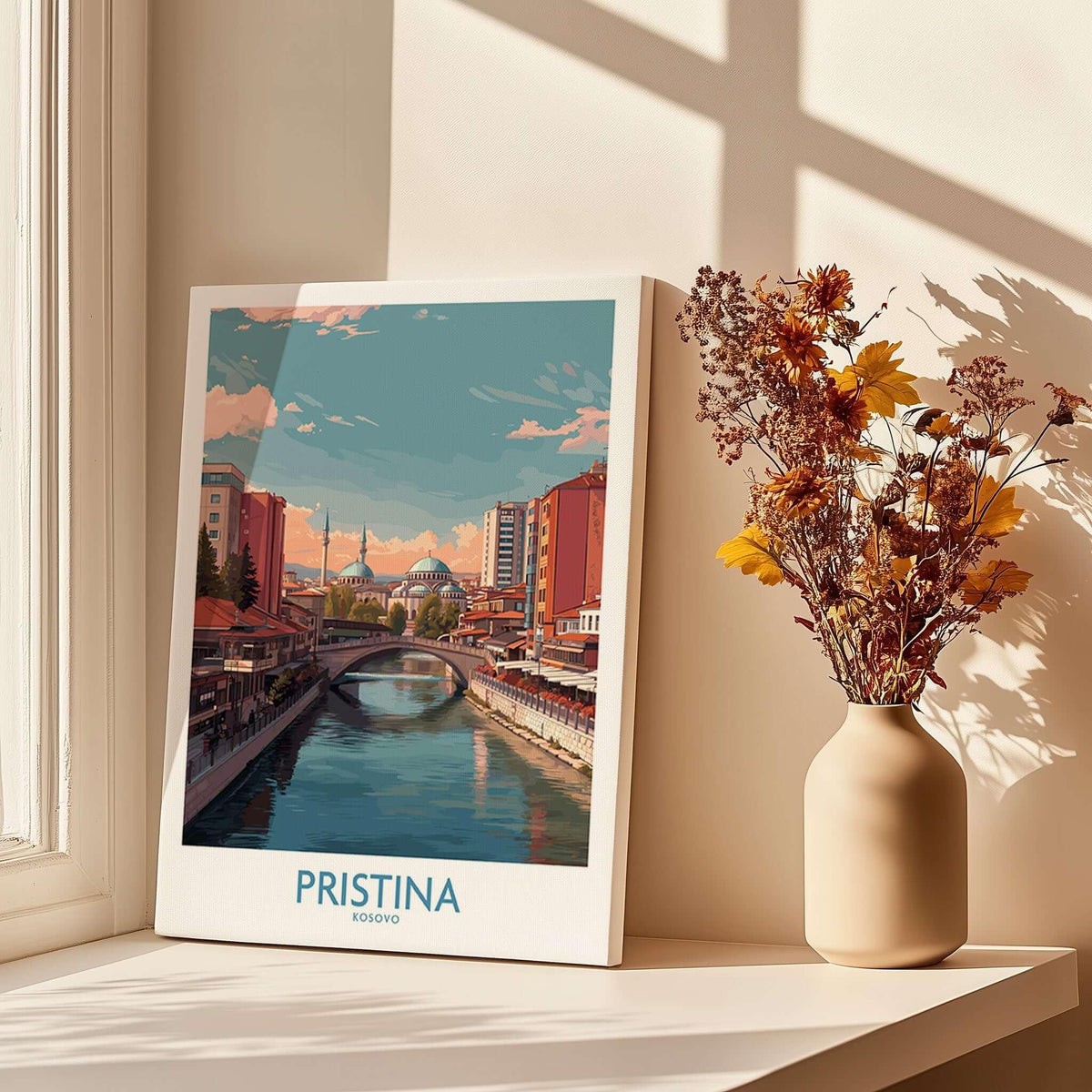 Pristina Kosovo River View Art Print | Cityscape Poster displayed on a windowsill with flowers in a vase.