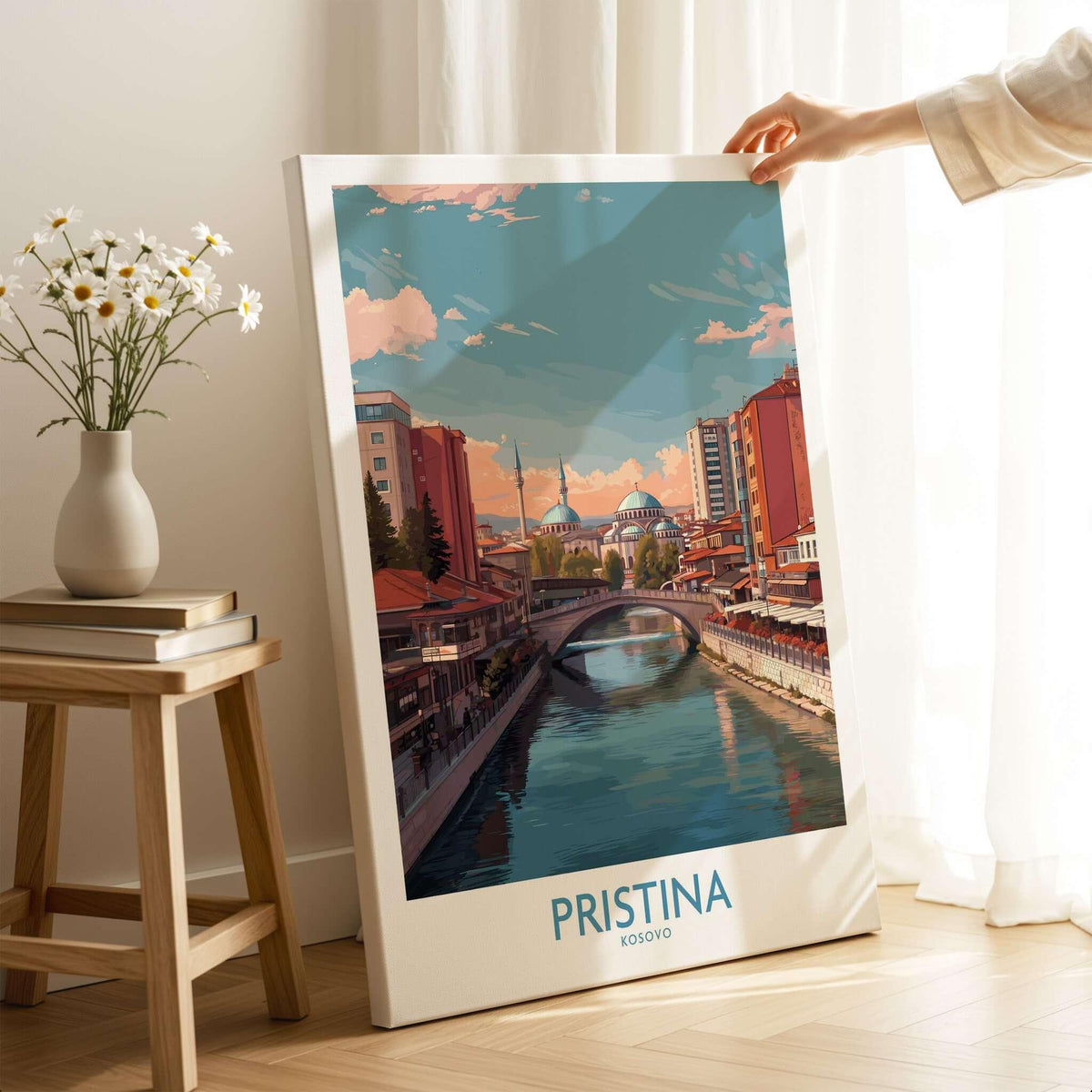Pristina Kosovo River View Art Print | Cityscape Poster displayed in a modern setting by a window with flowers.