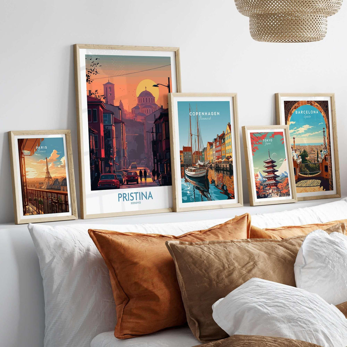 Pristina Kosovo Street Sunset Art Print | Christ the Saviour Church Poster among framed city art prints on a cozy couch.