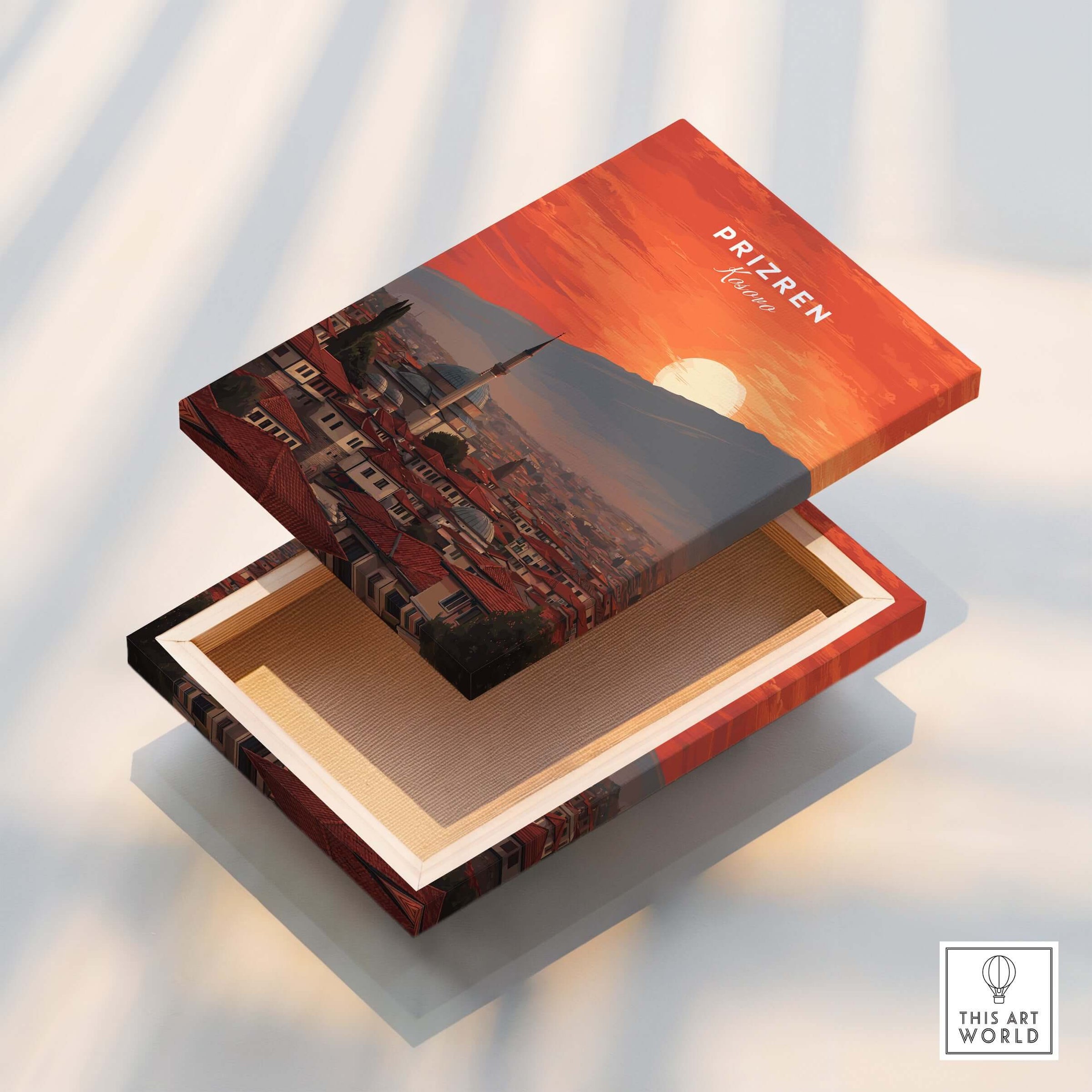 Prizren Canvas Art Print | Balkan Wall Decor showcased on an open box with a sunset view of the city.