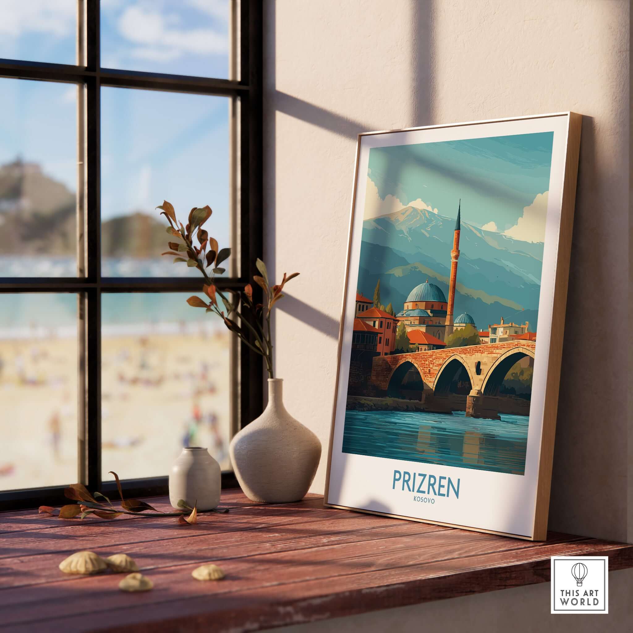 Prizren Kosovo Art Print displayed on a wooden windowsill, showcasing the city's charm and scenic beauty.