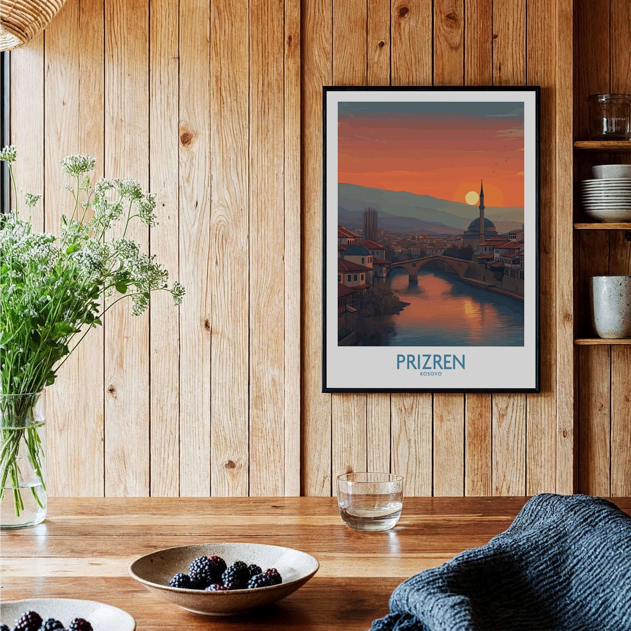Prizren Kosovo Sunset Art Print | River Bistrica View Poster framed in a cozy room setting with wooden decor.