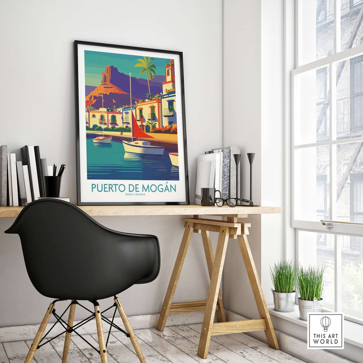 Puerto de Mogán travel poster showcasing sailboats and coastal views in a stylish workspace setting.