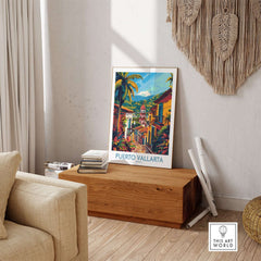 Interior featuring a Puerto Vallarta Travel Print on a wooden table, showcasing vibrant colors and tropical scenery.